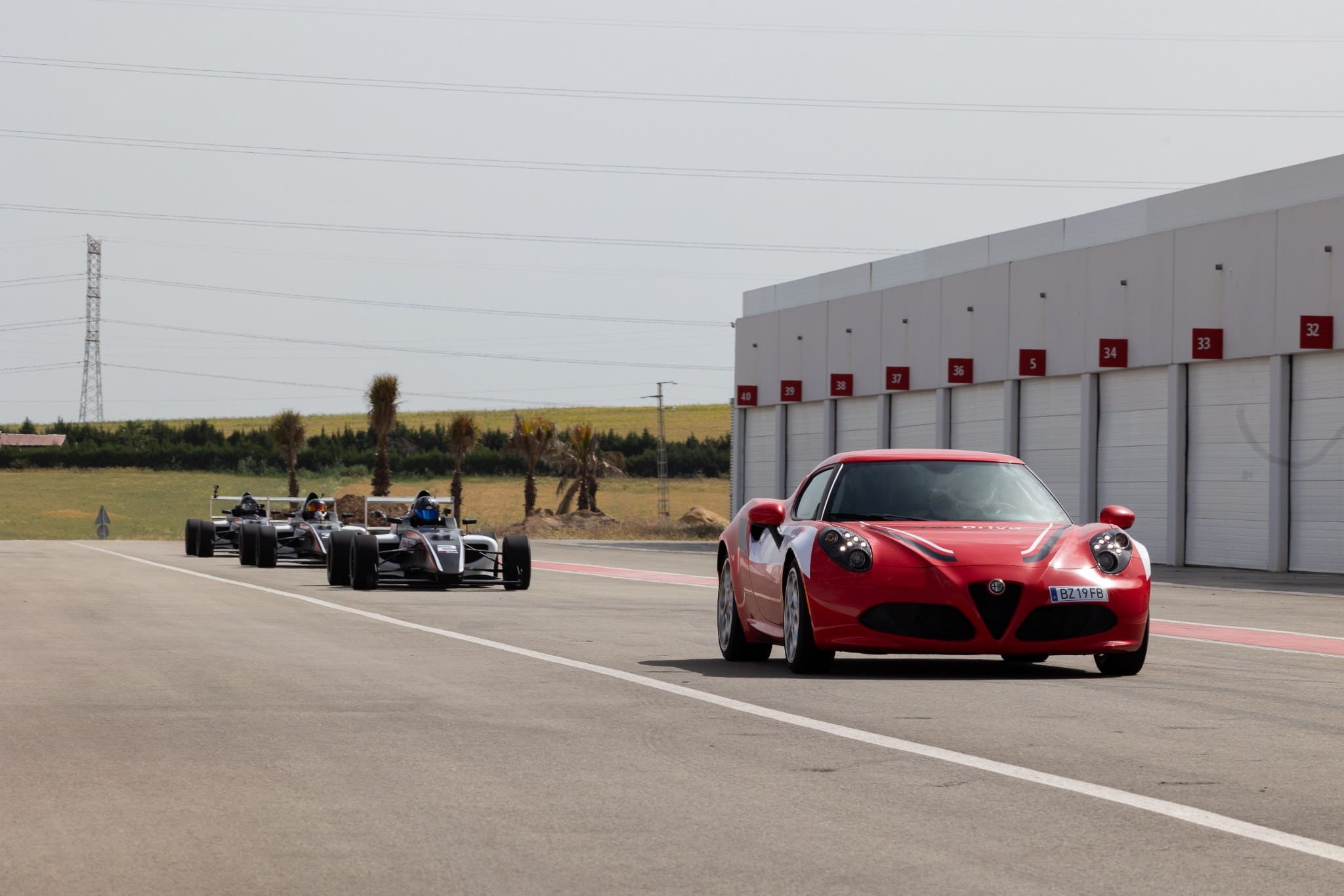 Formula 4 car and driver preparation during a YouDrive track event.