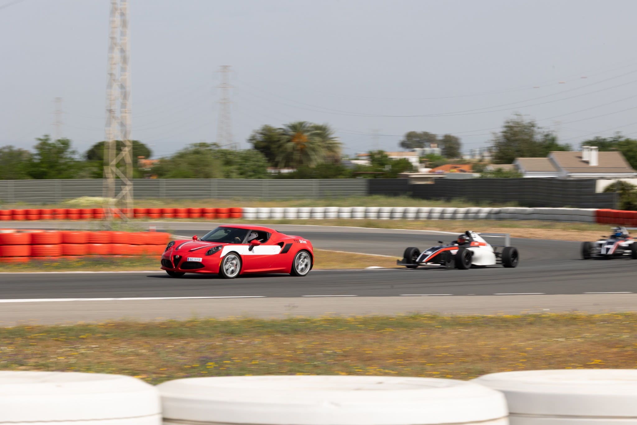 YouDrive Formula 4 event detail with a premium motorsport atmosphere.