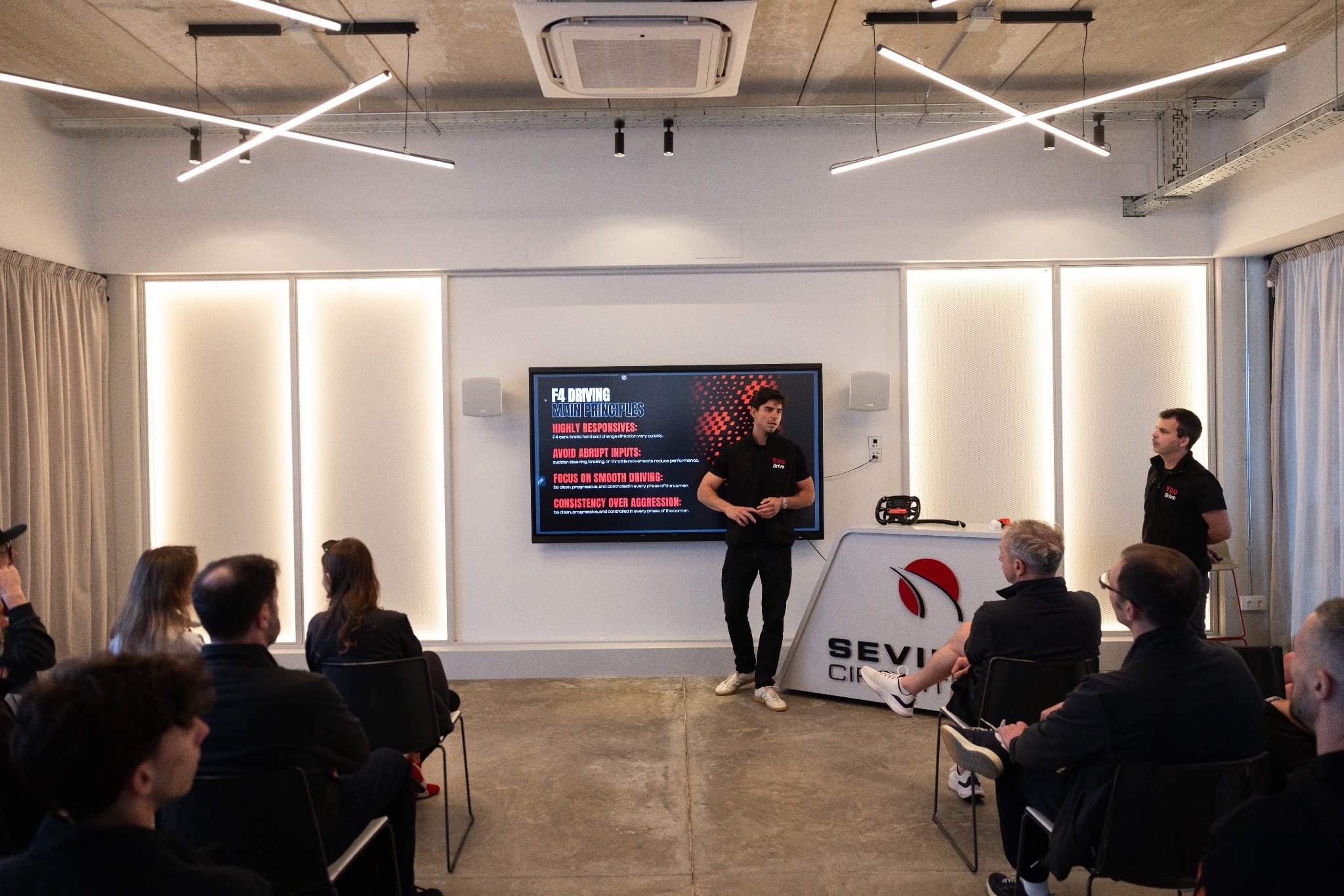 YouDrive team briefing participants before a Formula 4 driving experience.