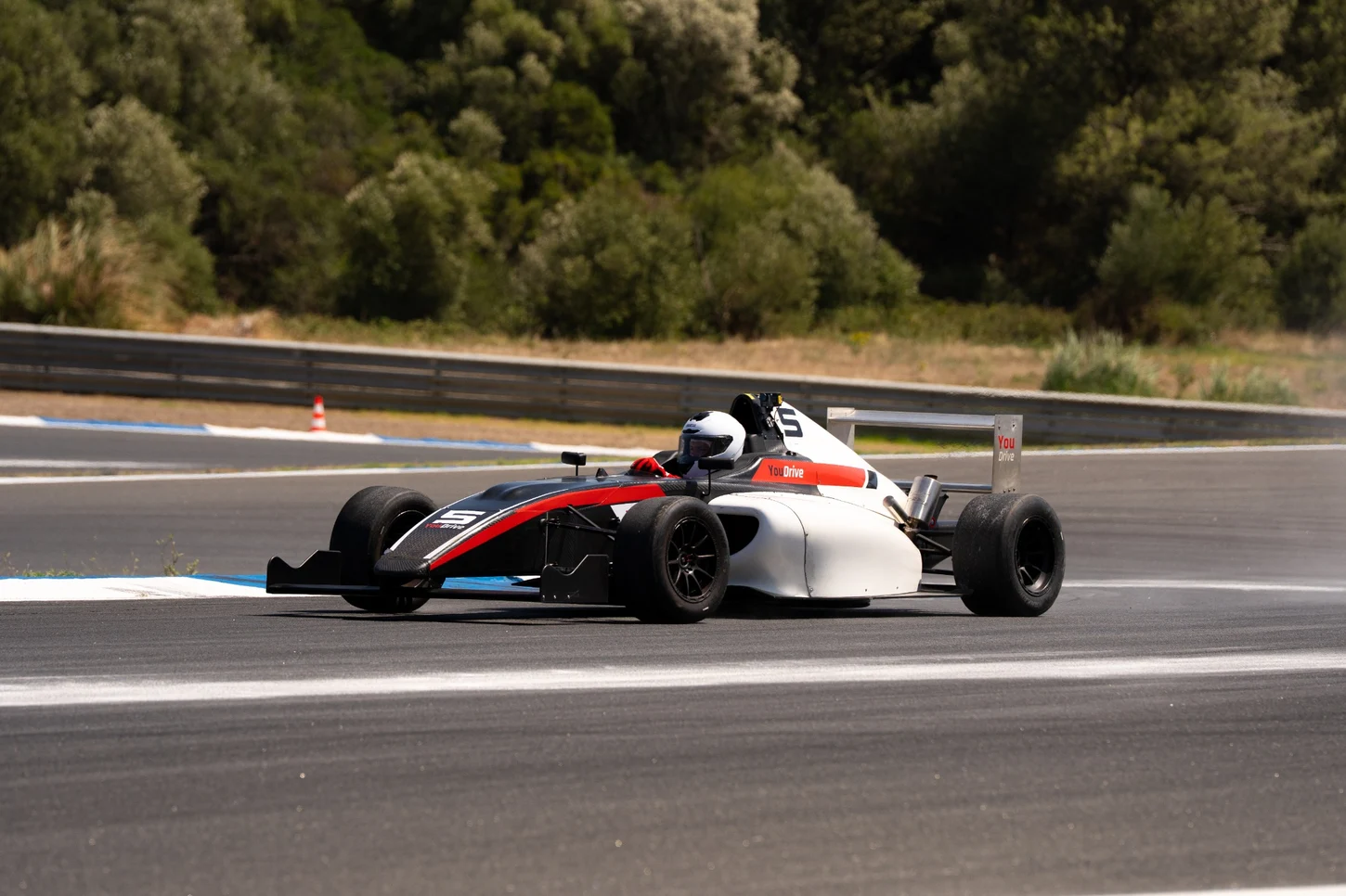 Formula 4 car on track during a YouDrive F4 experience