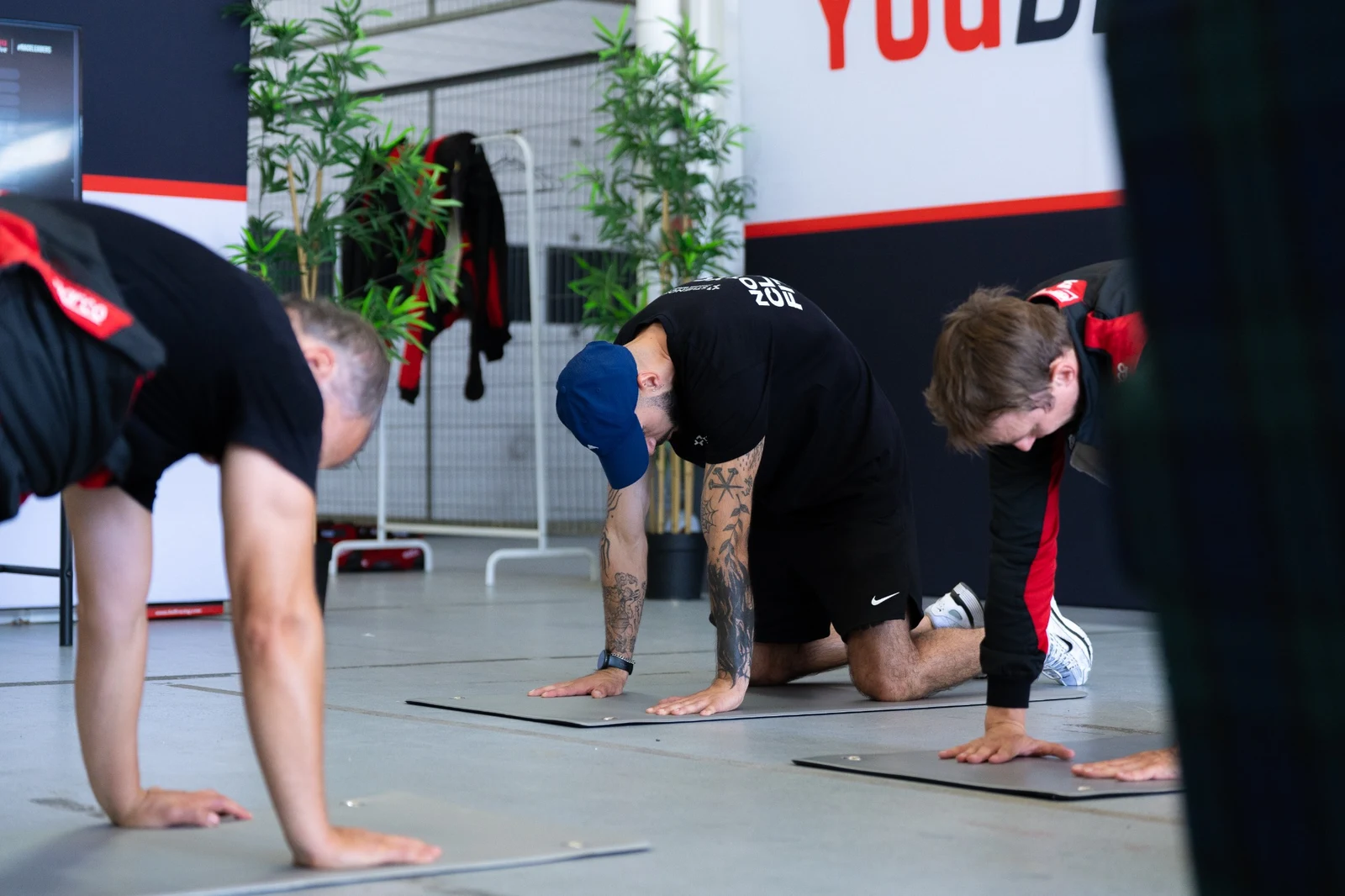 Personal trainer supporting participants during a YouDrive experience
